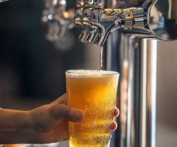 Beer being poured from tap.