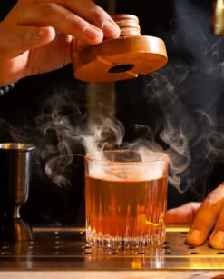 Bartender preparing cocktail.